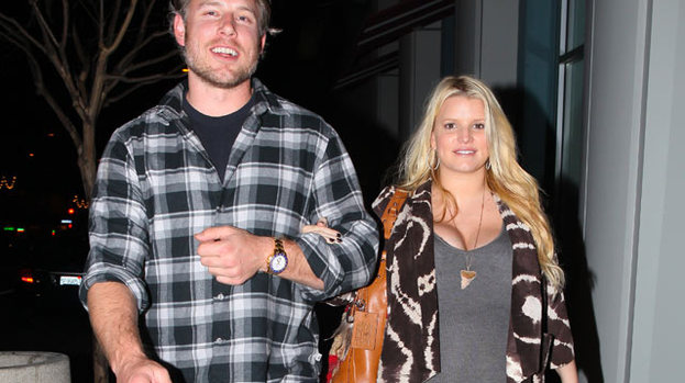 Baby love: Jessica Simpson (with Eric Johnson) showing off her growing baby bump back in January