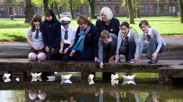  - 123169-fiona-hyslop-and-louise-wyllie-with-pupils-from-riverside-and-st-saviour-primaries-in-govan-launching-big-little-paper-boats-in-elder-park-year