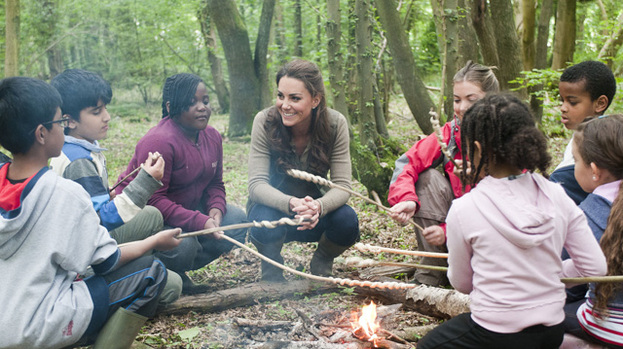 Back to nature: Duchess Kate looked at ease during her visit to the campsite yesterday