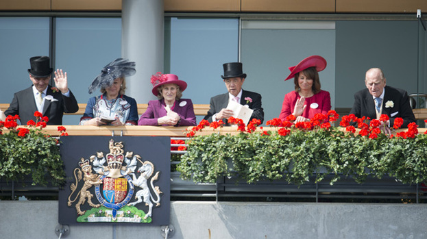 Right Royal day out: Carole Middleton (in red) laughs with Prince Philip (far right). Michael Middleton sits far left