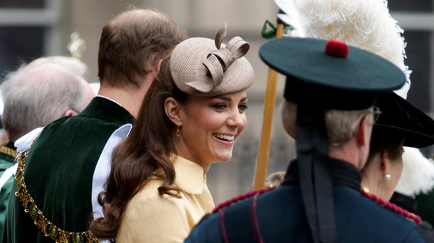 Pretty as a primrose: Duchess Kate looked summery in a yellow coat dress
