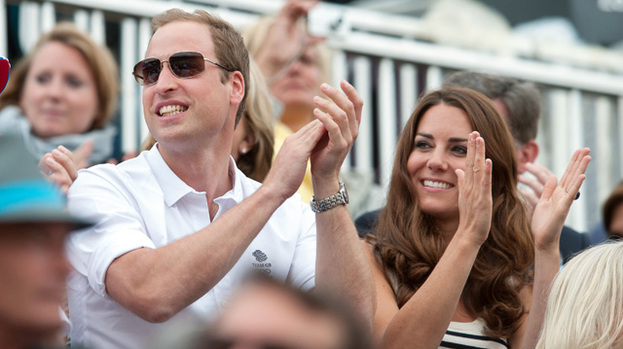Jumping for joy: Duchess Kate and Prince William were delighted to watch Zara's team win silver at the Olympics