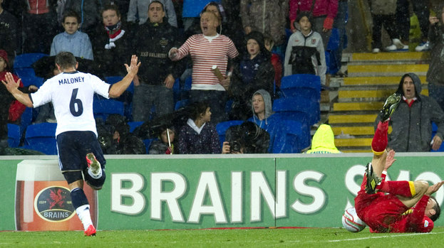Gareth Bale (right) goes down in the penalty area which earns Wales a spot kick