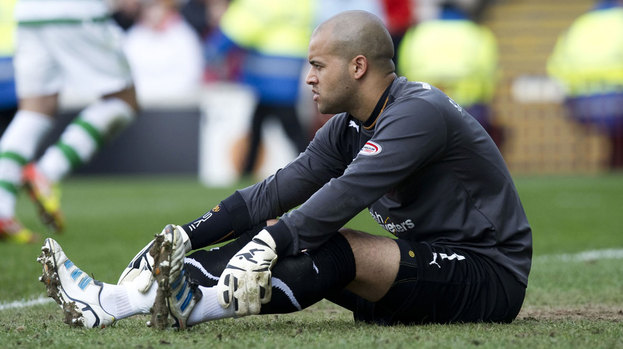 Darren Randolph sitting on the turf at Motherwell.