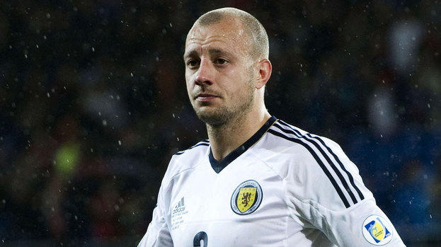 Alan Hutton in action for Scotland.