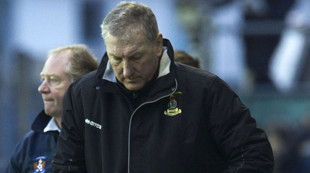 ICT manager Terry Butcher seems dejected as he heads for the dressing room at full time.