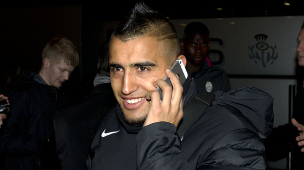 Juventus ace Arturo Vidal is all smiles as he arrives in Glasgow ahead of the Champions League clash with Celtic.