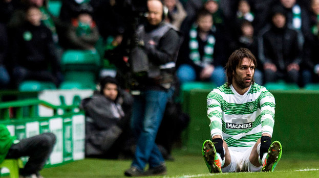 Georgios Samaras cuts a dejected figure on the touchline as Celtic suffer defeat to Aberdeen