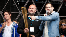 Jim King brings the torch onto the Main Stage