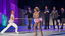 Chloe Madeley and Michael Zenezini skate with a skipping rope