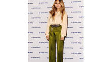 Zara Martin wears a 70s style floaty blouse and high-waisted trousers
