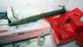Seized: A breaking stick and medication among items found at Barbara's home.